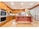 Open kitchen boasts stainless appliances, granite countertops, and a central island at 395 Suzanne Peak Ct, Henderson, NV 89012