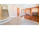 Open living room features hardwood flooring and a stone fireplace at 395 Suzanne Peak Ct, Henderson, NV 89012