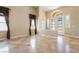 Spacious living room with high ceilings, large windows, and beautiful tile flooring throughout at 395 Suzanne Peak Ct, Henderson, NV 89012