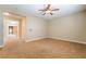 Living room with carpeted floors and a ceiling fan at 395 Suzanne Peak Ct, Henderson, NV 89012