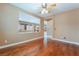 Spacious living room featuring wood floors and a pass-through to a sunroom at 395 Suzanne Peak Ct, Henderson, NV 89012
