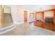 Open living room features hardwood flooring and a stone fireplace at 395 Suzanne Peak Ct, Henderson, NV 89012