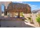 Outdoor bar area with built in grill and thatch roof; perfect for entertaining guests at 395 Suzanne Peak Ct, Henderson, NV 89012