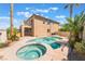 Inviting backyard pool and spa surrounded by lush landscaping, ideal for relaxation and outdoor enjoyment at 395 Suzanne Peak Ct, Henderson, NV 89012