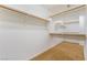 Walk-in closet with carpeted floors and ample shelving space at 395 Suzanne Peak Ct, Henderson, NV 89012