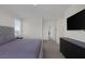 Spacious bedroom featuring neutral decor, a plush bed, and a dark dresser for ample storage at 4050 Midnight Crest Ave, North Las Vegas, NV 89031