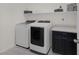 Bright laundry room with modern washer and dryer, plus functional storage and decor at 4050 Midnight Crest Ave, North Las Vegas, NV 89031