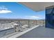 Balcony view from a high-rise condo, offering city vistas and a sleek, modern design with glass railings and concrete floors at 4381 W Flamingo Rd # 1101, Las Vegas, NV 89103