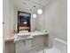 Bathroom with large mirror, single sink, and simple stylish decor at 4381 W Flamingo Rd # 1101, Las Vegas, NV 89103