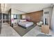 Sleek bedroom design with mirrored wall, neutral tones, and elegant furnishings offers a calming retreat at 4381 W Flamingo Rd # 1101, Las Vegas, NV 89103