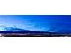 A picturesque night-time skyline view showcasing mountains and city lights at 4381 W Flamingo Rd # 1101, Las Vegas, NV 89103