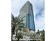 Stunning view of the Palms Place Las Vegas condo building with modern architectural design and palm trees at 4381 W Flamingo Rd # 1101, Las Vegas, NV 89103