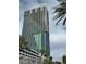 View of the Palms Place condo building showcasing modern architectural design with a blue glass facade and sleek balconies at 4381 W Flamingo Rd # 1101, Las Vegas, NV 89103