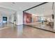 Hotel hallway showcasing a fitness center, elevators, and modern design elements, creating a functional and stylish space at 4381 W Flamingo Rd # 1101, Las Vegas, NV 89103