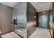 Hallway with stainless steel appliance facade and access to a doorway at 4381 W Flamingo Rd # 1101, Las Vegas, NV 89103