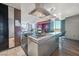 Modern kitchen with sleek countertops, stainless steel appliances, and a breakfast bar, perfect for culinary enthusiasts at 4381 W Flamingo Rd # 1101, Las Vegas, NV 89103