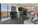 Spacious living room with modern decor, fireplace, city views, and open layout, ideal for entertaining guests in style at 4381 W Flamingo Rd # 1101, Las Vegas, NV 89103