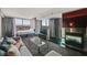 Comfortable living room with large windows, a fireplace, and modern furnishings, offering a relaxing space with city views at 4381 W Flamingo Rd # 1101, Las Vegas, NV 89103