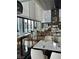 Bright and airy restaurant with modern furnishings, a view of the pool, and elegant table settings at 4381 W Flamingo Rd # 1101, Las Vegas, NV 89103