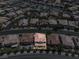 Birds-eye perspective of a home in a planned community with uniform landscaping and red tile roofs at 4607 El Camino Cabos Dr, Las Vegas, NV 89147