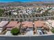 Aerial view of a residential neighborhood featuring tile roofs and desert landscaping at 4607 El Camino Cabos Dr, Las Vegas, NV 89147