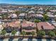 Scenic aerial perspective showcasing a row of homes with desert landscaping and tile roofs at 4607 El Camino Cabos Dr, Las Vegas, NV 89147