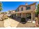 Home exterior with a covered patio, desert landscaping, and a stone pathway at 4607 El Camino Cabos Dr, Las Vegas, NV 89147