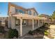 Home exterior featuring a covered patio and low-maintenance desert landscaping in the backyard at 4607 El Camino Cabos Dr, Las Vegas, NV 89147