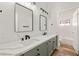 Elegant bathroom featuring double sinks, quartz countertops, and modern fixtures at 4607 El Camino Cabos Dr, Las Vegas, NV 89147
