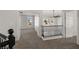 Upstairs hallway with decorative railing overlooking a living space with palm tree views at 4607 El Camino Cabos Dr, Las Vegas, NV 89147