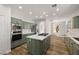 Kitchen featuring new cabinets and countertops and an island gas range at 4607 El Camino Cabos Dr, Las Vegas, NV 89147