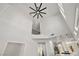 Bright living room with high ceilings, modern ceiling fan and open floor plan at 4607 El Camino Cabos Dr, Las Vegas, NV 89147