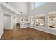 Expansive living room featuring high ceilings, large windows, and views into the kitchen at 4607 El Camino Cabos Dr, Las Vegas, NV 89147