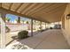 Spacious covered patio overlooking a landscaped backyard with desert plants and a stone pathway at 4607 El Camino Cabos Dr, Las Vegas, NV 89147