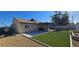 Exterior view of home with a patio, artificial grass, and gravel at 4690 E California Ave, Las Vegas, NV 89104