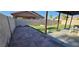 Backyard featuring artificial grass, concrete patio, and block wall at 4690 E California Ave, Las Vegas, NV 89104