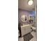 Bright, purple bathroom with a shower, vanity, sink, toilet, mirror, shelves and a rug at 4690 E California Ave, Las Vegas, NV 89104