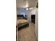 Bedroom with a bed, TV, shelves and a bright window offers a welcoming space to unwind at 4690 E California Ave, Las Vegas, NV 89104