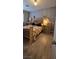 Cozy bedroom features wood floors, a queen-size bed and lamps for a relaxing atmosphere at 4690 E California Ave, Las Vegas, NV 89104