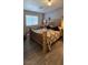 Cozy bedroom features wood floors, a queen-size bed and lamps for a relaxing atmosphere at 4690 E California Ave, Las Vegas, NV 89104