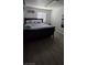 Neutral bedroom with modern floors, a queen-size bed and a bright window for natural light at 4690 E California Ave, Las Vegas, NV 89104