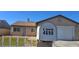 Close up of home address on mailbox, lawn and house slightly blurred in the background at 4690 E California Ave, Las Vegas, NV 89104