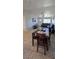 Well-lit open-concept living room featuring dining table, cozy seating, and bright neutral walls at 4690 E California Ave, Las Vegas, NV 89104