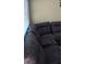 Comfortable living room with a plush sectional sofa and natural light at 4690 E California Ave, Las Vegas, NV 89104