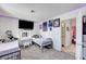 Comfortable bedroom setup with carpeting, a TV, and stylish decor at 4835 Nevada Ave, Las Vegas, NV 89104