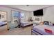 Bright bedroom featuring two beds, carpeting, and a well-lit vanity area at 4835 Nevada Ave, Las Vegas, NV 89104