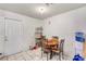Functional dining area with tile flooring, a round table with four chairs, and an exterior door at 4835 Nevada Ave, Las Vegas, NV 89104