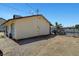 Exterior home view featuring a simple design with a chain link fence and access gate at 4835 Nevada Ave, Las Vegas, NV 89104