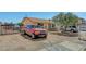 Wide view of a single story house with a truck and vehicles in the front and a chain link fence at 4835 Nevada Ave, Las Vegas, NV 89104