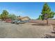Street view of a single story house with multiple vehicles in the front and block wall at 4835 Nevada Ave, Las Vegas, NV 89104
